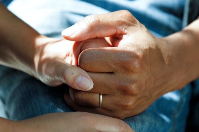 Image of Two People Holding Hands